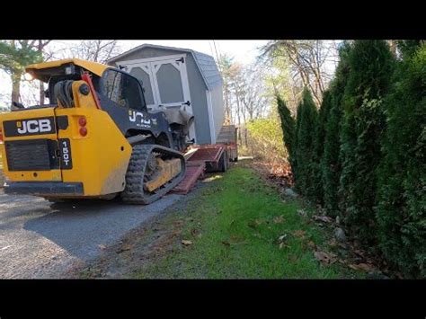 moving a shed with a skid steer|portable buildings on skids.